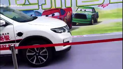 SUV knocks down hostess during intelligent braking system test