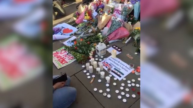 Bouquets and Candles Line Albert Square for Manchester Attack Victims