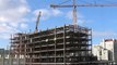 Time-lapse  Wide view of tower cranes with flowing clouds (4K)