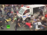 Philippines police van rams protesters during rally outside US embassy in Manila (GRAPHIC)