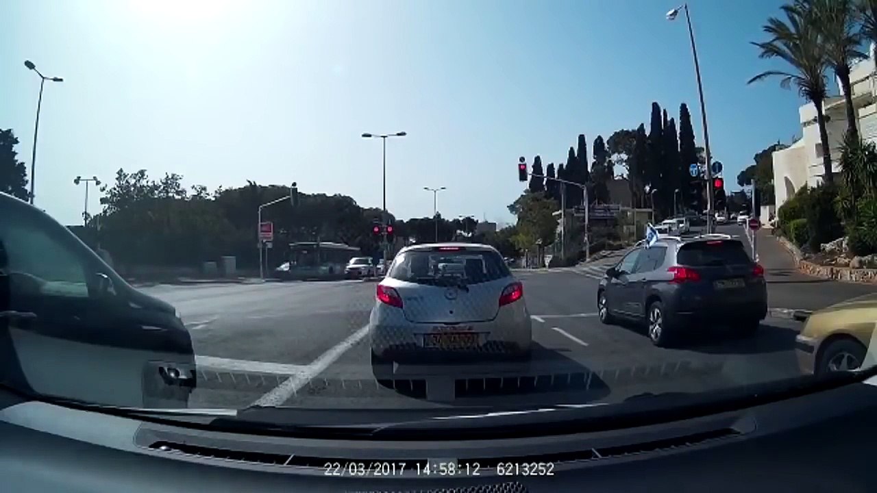 Audi A3 flips, crashes into light pole, then catches fire