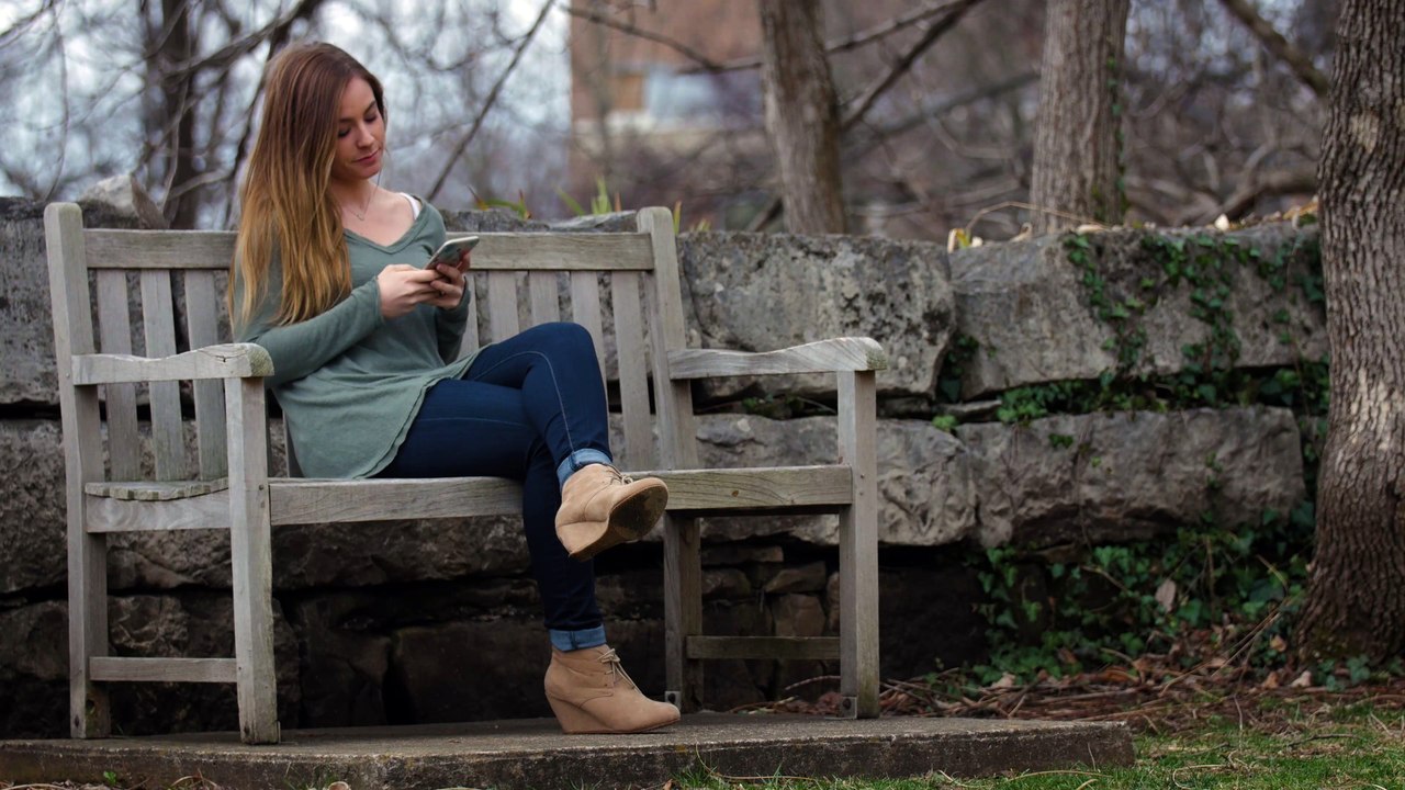 Girl_Checks_Phone