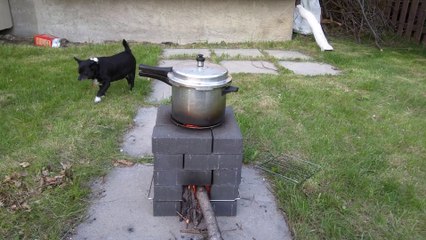 Wood burning rocket stove. Small backyard project this year. www.tantrapsychic.com
