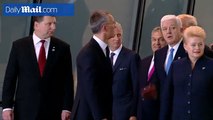 I'm in front! Trump shoves European leader aside to find his place at the center of NATO group photo
