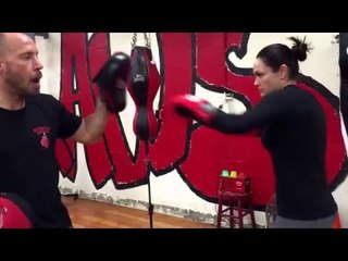 Brandon Krause working mitts with amateur boxer