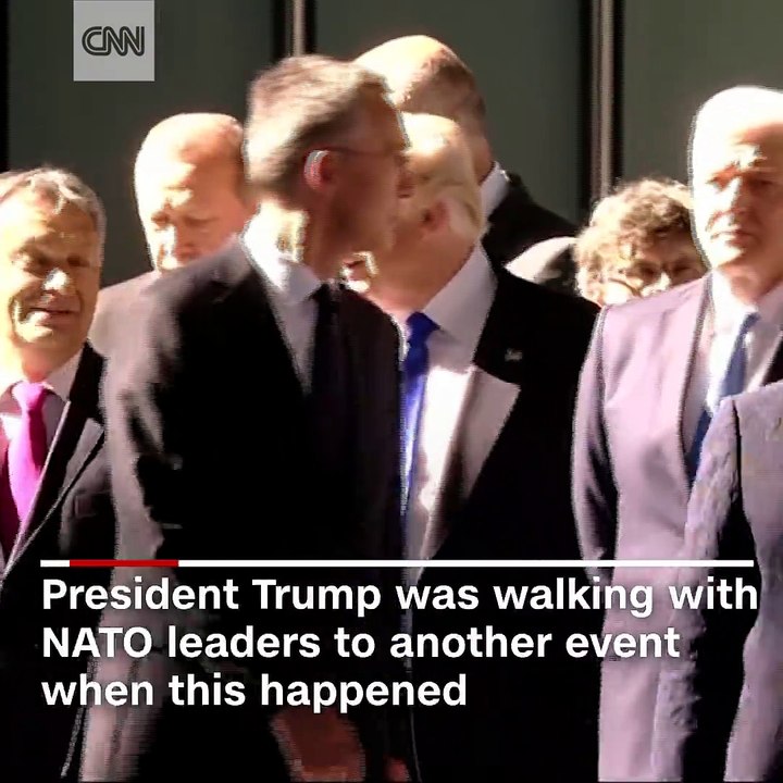 President Donald Trump appears to move aside the prime minister of Montenegro while at a NATO summit in Belgium
