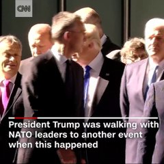 President Donald Trump appears to move aside the prime minister of Montenegro while at a NATO summit in Belgium