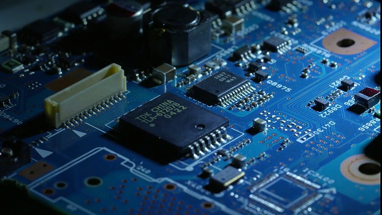 Rotating Around Harshly Lit Elements of a blue Circuit Board