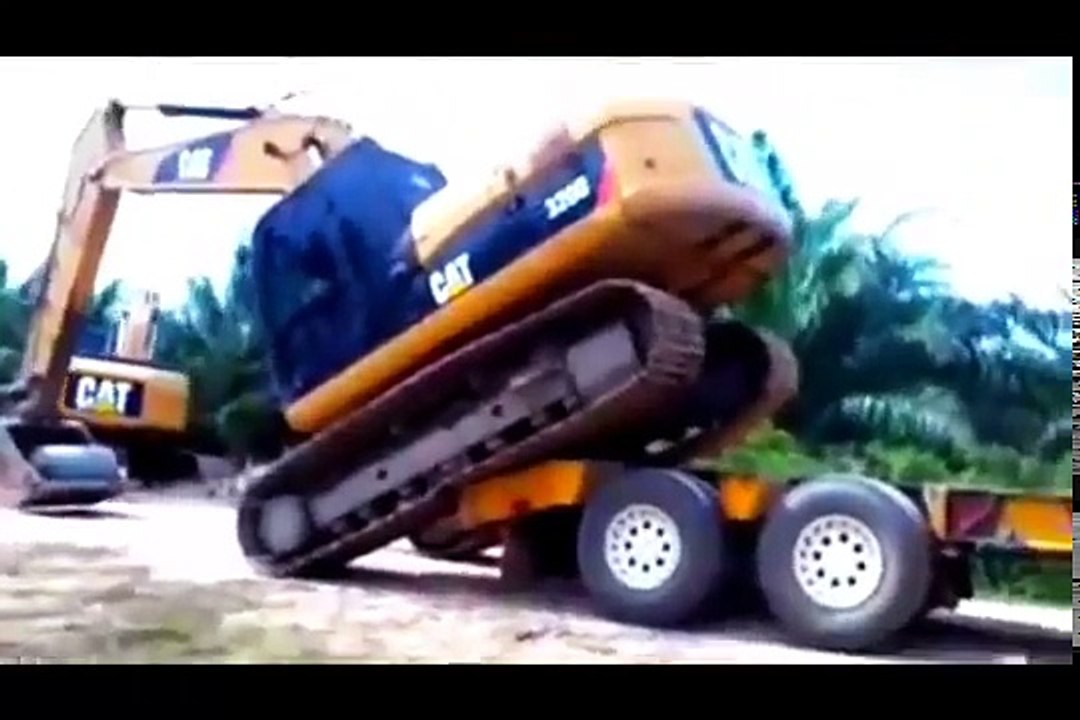 equipment loading fails, loading and unloading heavy equipment, loading trucks with excava