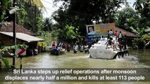 Sri Lankans wade through floodwaters after deadly monsoon