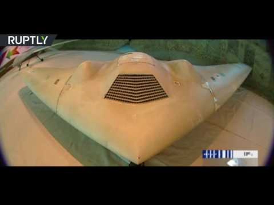 Iran unveils combat UAV based on captured US spy drone design