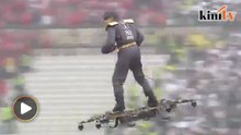 Man rides drone to deliver ball to referee