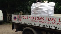 Unloading Logs in a bag. Four Seasons Fuel, West Sussex