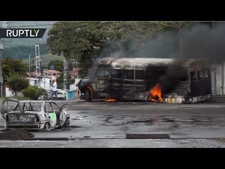 Hijacking & Molotov Cocktails: Venezuelan protesters set vehicles on fire, clash with police