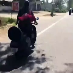 GIRL DANCING WHILE DRIVING SCOOTER