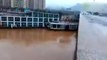 WATCH  Two Boats crash into a Bridge in China after being swept away by flood w