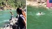 Video captures man swept away after jumping into rushing river in California - TomoNews