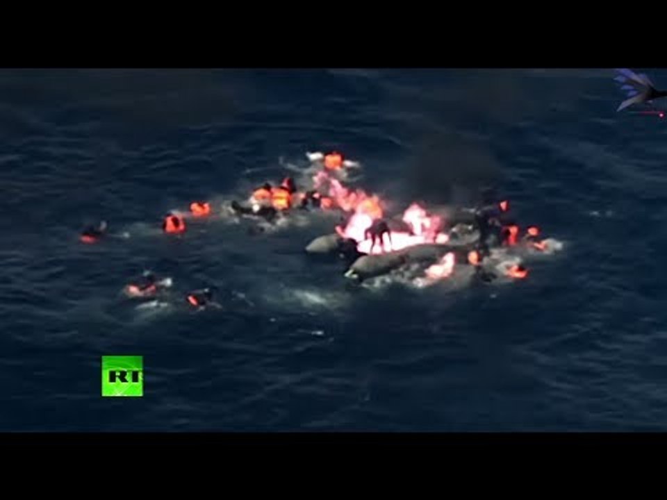 Moment migrant boat bursts into flames in Mediterranean