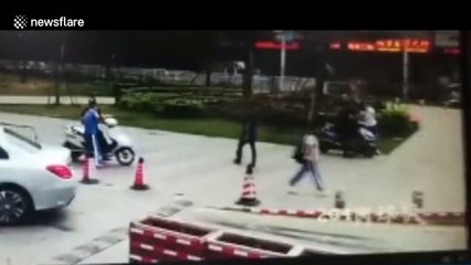 Mercedes driver appears to run over parking attendant deliberately