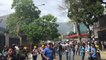Caracas Protesters Run From Tear Gas