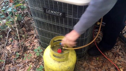Fieldpiece MR45 recovery unit recovering refrigerant from an air conditioner.