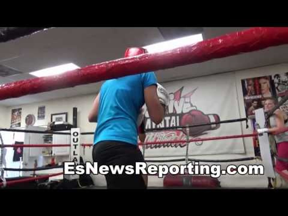 mma vs boxing: pro mma fighter (red) sparring golden gloves winner lisa porter