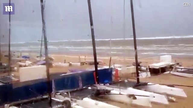 Dramatic moment seven foot tidal wave sweeps away beach chairs, mini tsunami strikes the Netherlands!