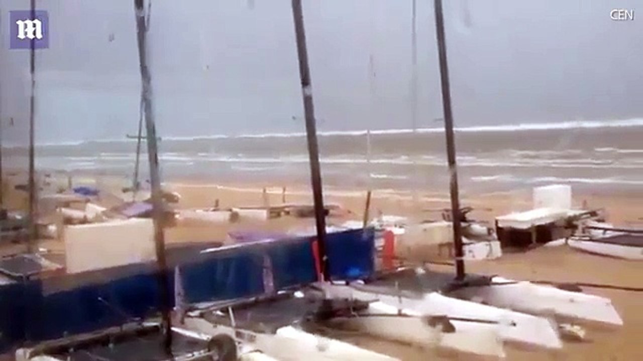 Dramatic moment seven foot tidal wave sweeps away beach chairs, mini tsunami strikes the Netherlands!