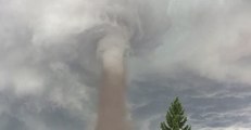 Swirling Tornado Passes Through Alberta Town