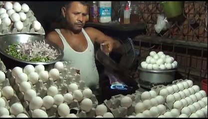 The man cooks the fried egg and gives it to the customer on the sandwich cool