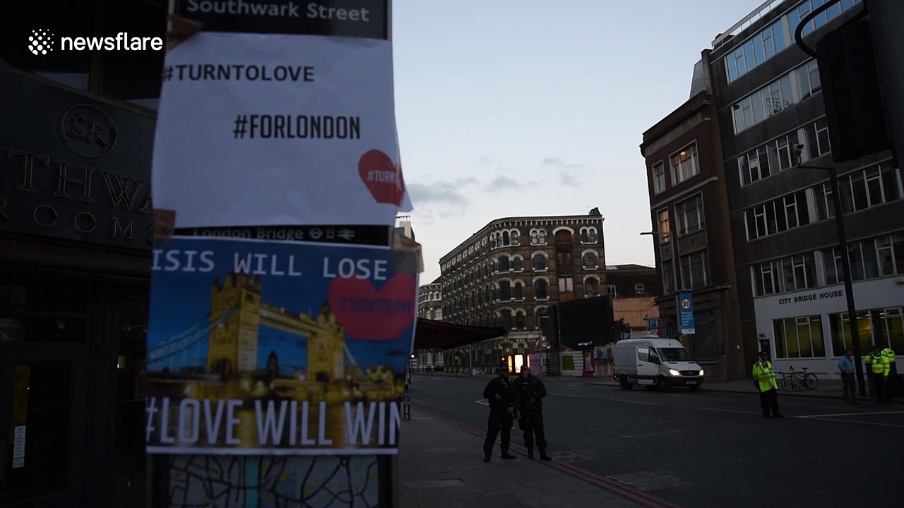 Flowers and other tributes appear around London Bridge
