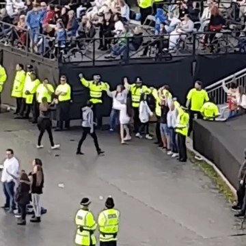 Police Officers Join Fans for Hand-in-Hand Singalong at #OneLoveManchester