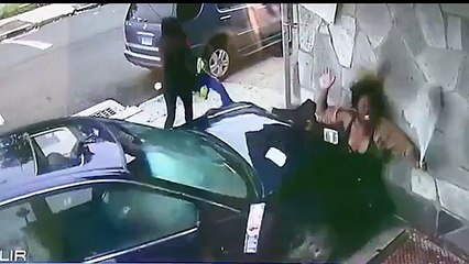 Brave woman shields boy from impact of car that rammed into wall