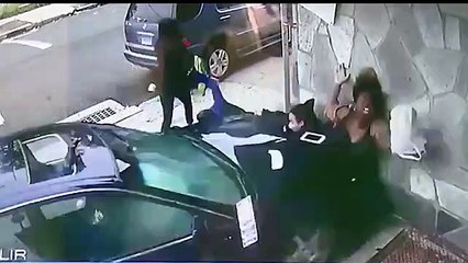 Brave woman shields boy from impact of car that rammed into wall