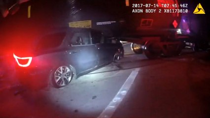 Bodycam video shows train dragging car along after crash