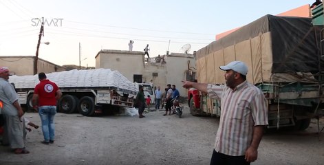 Video herunterladen: International Aid Convoy Arrives in Opposition-Controlled Northern Homs Province