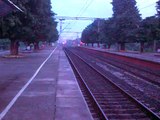 Danapur-Howrah Superfast Express tearing the tracks at Rajbandh Station with a HWH WAP-4 loco.3gp