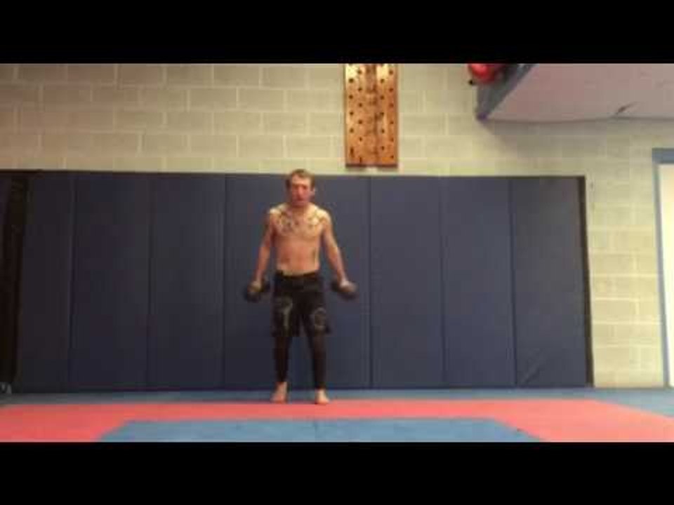 Man Pulls Off Backflip While Holding 12-Pound Dumbbells