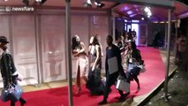 Winnie Harlow trips on Glamour Awards red carpet