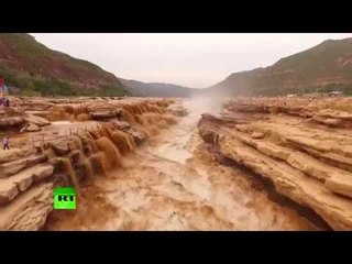 Mesmerizing force of nature: Chinese waterfall in spectacular rage after rainfall (Aerial footage)