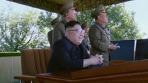 Watch a childlike Kim Jong-un chuckle at North Korean military display