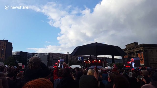 Rainbow appears next to Jeremy Corbyn as he delivers speech