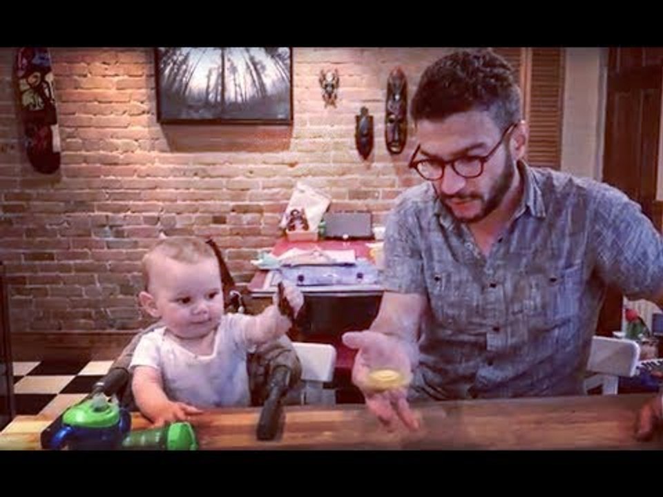 Man Balances Spinning Top on Alternate Fingers
