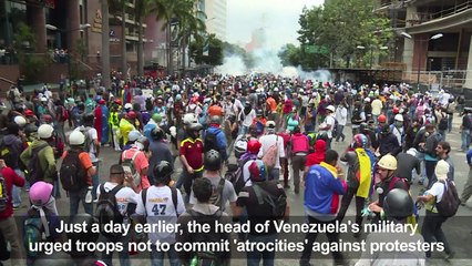 Police use tear gas to disperse opposition march in Caracas