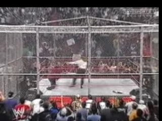 Triple H Attacks Foley In The Cell