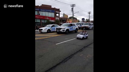 Twins, 2, drive in mini police car alongside NYPD officers