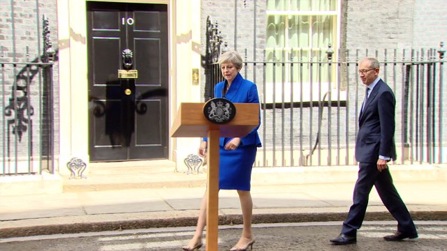 Defiant May vows to stay on despite UK election blow