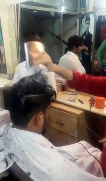 India Barber Uses Fire To Give Haircuts -