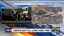 Fire crews battle first-alarm fire at a junkyard in Phoenix