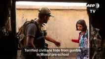 Terrified civilians hide from gunfire in Mosul pre-school